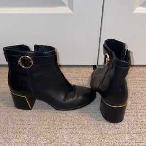 Tory Burch black bootie with gold detail